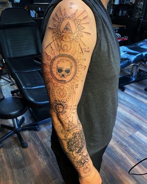 Explore the intricate fusion of blackwork and geometric patterns in this stunning sleeve tattoo designed by Frankie Brown.