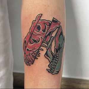 Express your love for dinosaurs with this colorful new school tattoo on your forearm, expertly done by Matthew Ono.