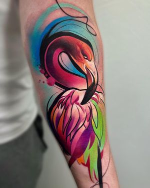 Express your love for nature and beauty with this colorful illustrative watercolor tattoo by Cloto.tattoos. Let this majestic flamingo soar on your forearm!