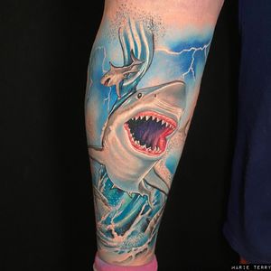 Impressive forearm tattoo of a shark designed in new school and realism styles by tattoo artist Marie Terry.