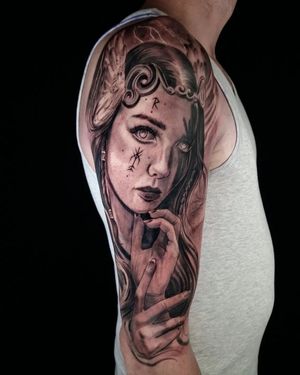 Capture the beauty of a woman with stunning realism in this black & gray sleeve tattoo by Mauro Imperatori.