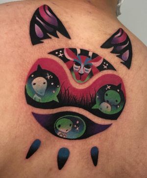 An illustrative surrealism tattoo featuring a moon, dog, cat, alien, and UFO on the upper back by Cloto.tattoos.