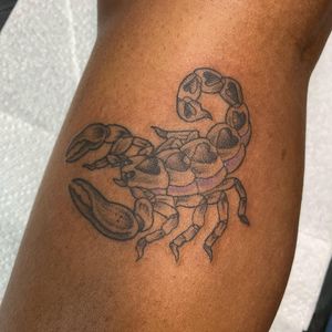 A stunning tattoo featuring a traditional style scorpion and heart motif on the forearm, by Letitia Mortimer.