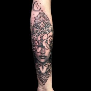 Experience the beauty of micro_realism and ornamental style with this stunning tattoo featuring a moon, flower, mandala, and woman by Avi.