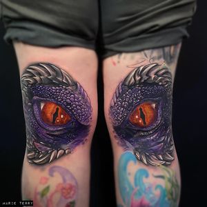 Experience the power of the dragon with this vibrant new school style tattoo on your knee by Marie Terry.