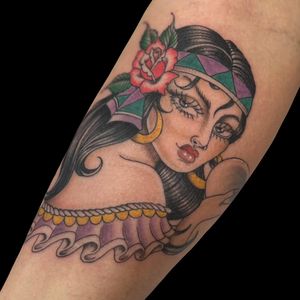 Get inked with Letitia Mortimer's chicano style tattoo featuring a mesmerizing gipsy woman on your forearm.
