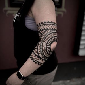 Elegant blackwork mandala design with geometric patterns, perfect for elbow placement. Created by talented artist Lamat.