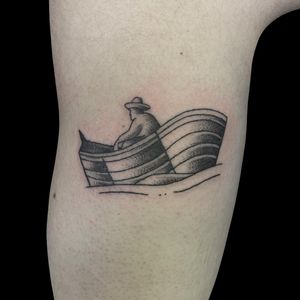 Dotwork upper arm tattoo featuring a man in a hat on a boat, done by Letitia Mortimer. Detailed and elegant design.