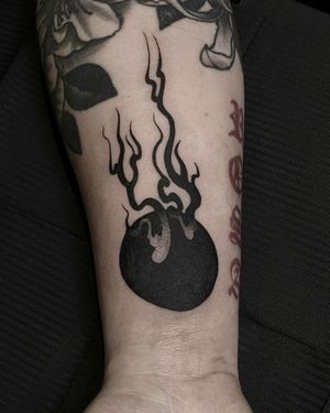 Experience the protective power of a traditional omamori charm in stunning blackwork style on your forearm, created by talented artist Luca Salzano.