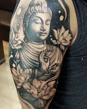 Elegant black and gray illustrative design by Avi, featuring a beautiful flower and serene buddha motif.