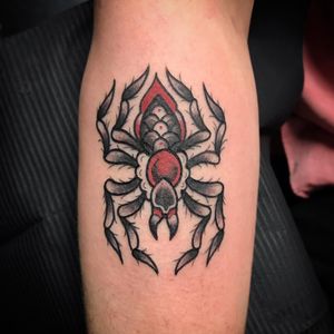 Capture the creepiness of the spider with this black and gray design by Matthew Ono on your forearm. A bold statement piece!