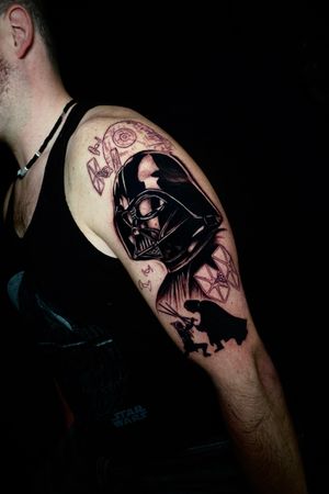 Impressive blackwork tattoo of Darth Vader on upper arm, blending anime and realism styles by Miss Vampira.