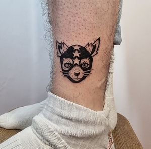 Vibrant and playful new school style tattoo of a dog on the lower leg by Jonathan Glick.
