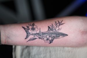 Stunning black and gray forearm tattoo by Soheyl Astangi featuring a surreal shark and delicate floral design.