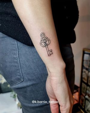Unlock the beauty of this intricate fine line key design by Katia Barria, a stunning addition to your forearm.
