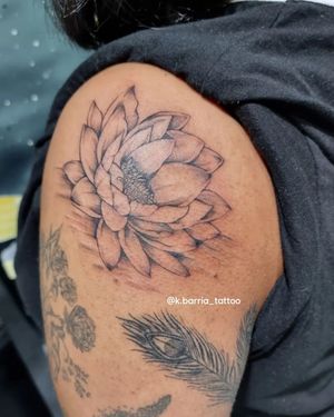 Let Katia Barria create a stunning fine line peony tattoo on your upper arm, adding a touch of floral beauty to your body.