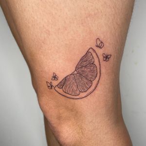 Fineline lemon slice tattoo 
