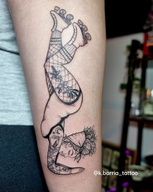 Unique black and gray forearm tattoo of a woman skating by artist Katia Barria. Edgy and stylish design.