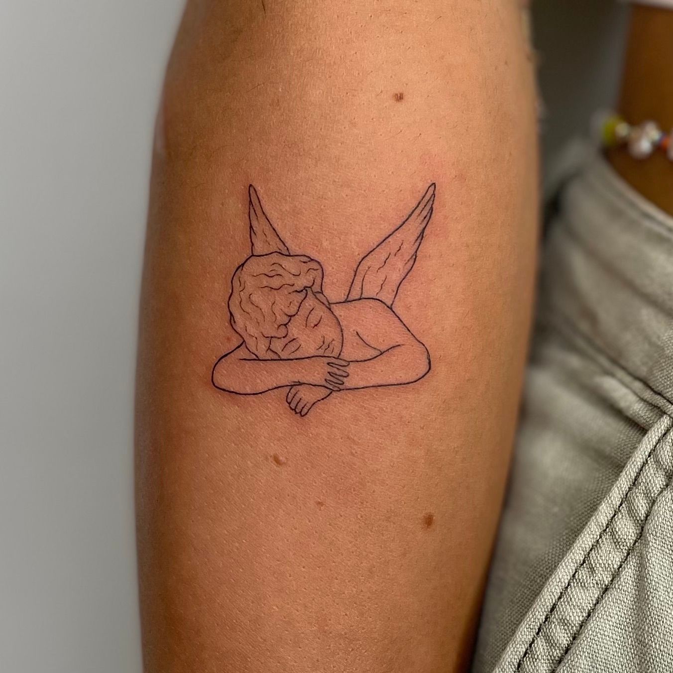 Micro Cherub tattoo 👼 Done using single needle 🪡 Thanks for the trust,  Jherrel! More soon! . . . . #tattoo #tattooed #tattooideas ... | Instagram