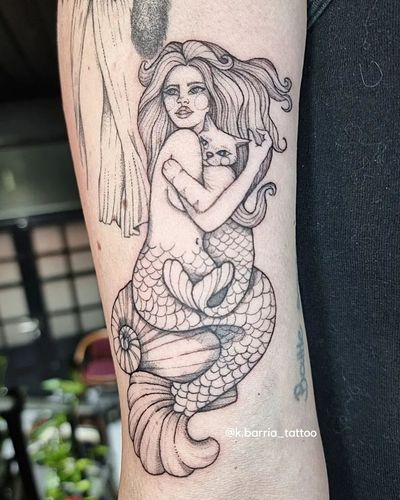 Unique black and gray forearm tattoo by artist Katia Barria, featuring a mystical fusion of a cat and a mermaid design.