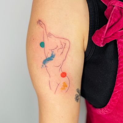 Fineline tattoo of a woman's body with abstract colour accents 