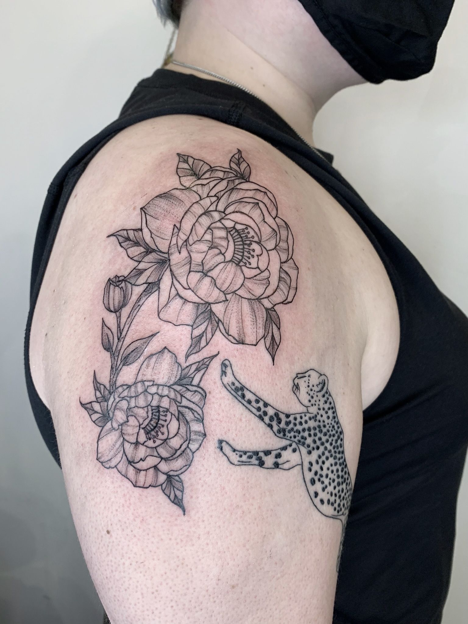 cheetah print and flower tattoo