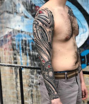 Dive into a dream-like world with this intricate illustrative surrealism pattern sleeve tattoo by talented artist Gifford Kasen.