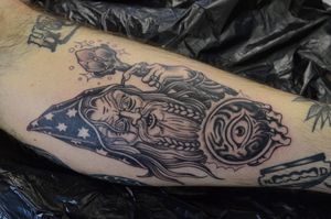 Get mystical with this traditional wizard tattoo by Adam Ruff, perfect for your lower leg. Embrace your inner magic!