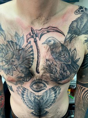 Embrace the traditional with a bold scythe tattoo by Adam Ruff, perfect for your chest.