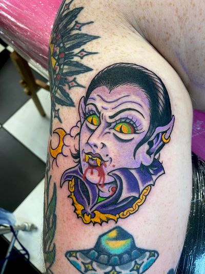 Elegant and bold vampire design on the upper arm, blending neo-traditional and new school styles. Let this tattoo be your eternal guardian.