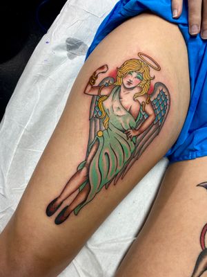 Beautiful neo-traditional tattoo of an angelic woman on your upper leg by Adam Ruff. A stunning and symbolic piece of art.