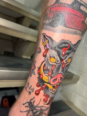 Check out this stunning neo-traditional hog tattoo by talented artist Adam Ruff. Perfect for the forearm, this bold and vibrant design is sure to make a statement.