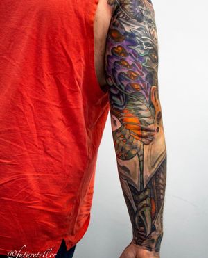 Unique illustrative sleeve tattoo featuring intricate and captivating patterns by artist Gifford Kasen.