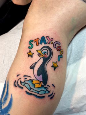 Express your love for penguins with this fun new school style lettering tattoo on the upper arm by artist Adam Ruff.