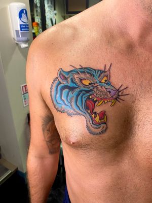 Stunning tiger design by Adam Ruff, placed on the chest in a traditional yet modern style.