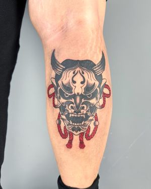 Explore the traditional Japanese art of tattooing with this stunning hannya design by Hansol Jung, perfectly placed on the lower leg for ultimate impact.