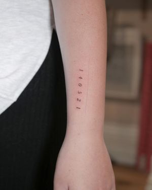 Fine line and small lettering by Alexander Rufio, perfect for a discreet and meaningful tattoo.