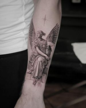 Experience the guiding light of a majestic lighthouse with an angelic touch in this breathtaking black and gray realism piece by Alexander Rufio.