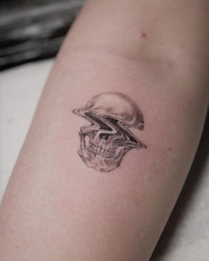 Experience the haunting beauty of a black and gray surreal skull tattoo by the talented artist Alexander Rufio.