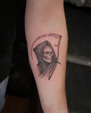 Capture the essence of death with this striking black and gray tattoo by Alexander Rufio on your forearm.