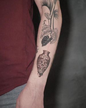 Detailed black & gray tattoo on forearm by artist Alexander Rufio. A stunning combination of scorpion and vase motifs.