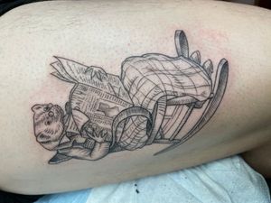 Capture the unique charm of a ferret perched on a chair, with a newspaper nearby. Exquisitely detailed in fine line style by Ermis Atzemoglou on upper leg.