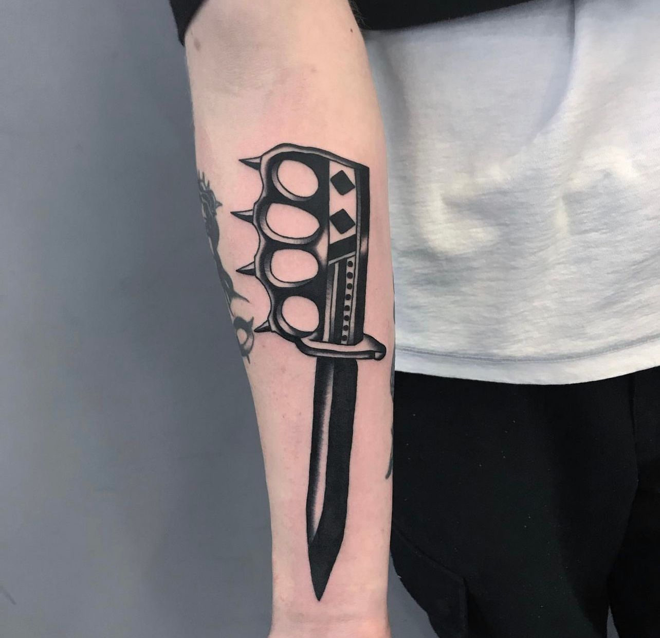 Ironside Tattoo & Piercing - @jsark did this rad trench knife and rose  piece! Who else has a rad #daggerandrose tattoo? . . . . . . . . . .  #ironside #