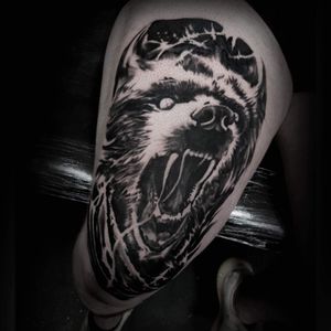 Impressive blackwork bear tattoo on the knee done by Rachel Aspe at Bellatrix Tattoo. Unique and fierce design!