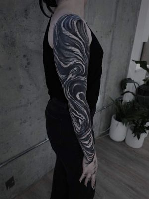 Get a stunning pattern tattoo on your sleeve with this intricate blackwork design by Rachel Aspe at Bellatrix Tattoo.