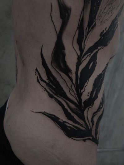 Unique blackwork tattoo with intricate leaf pattern by Rachel Aspe at Bellatrix Tattoo.