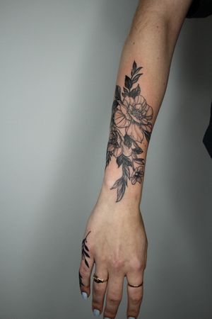 elegant floral blackwork tattoo