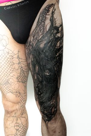 Discover a mesmerizing blend of pattern and surrealism in this illustrative knee tattoo by artist Gifford Kasen.