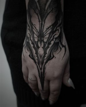Elegant black and gray pattern tattoo on hand by Rachel Aspe at Bellatrix Tattoo.
