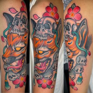 Vibrant neo-traditional tattoo on upper arm featuring a mystical fox and skull, by the talented artist Carlos Zucato.
